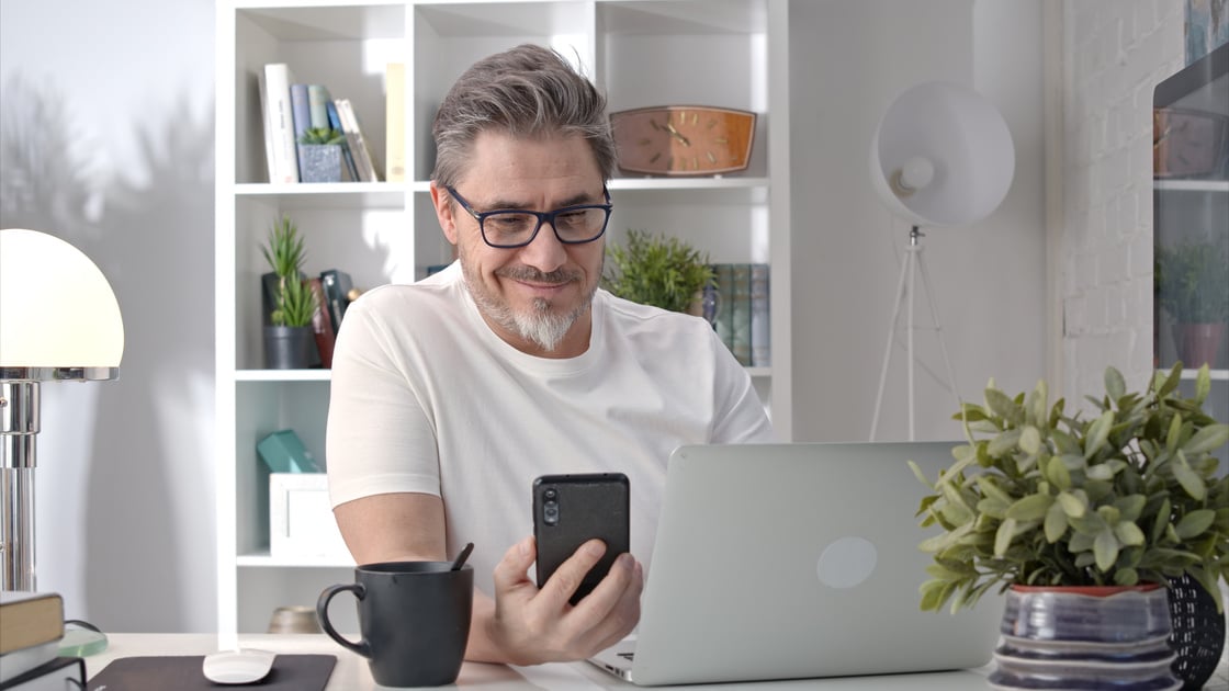 Man Using Phone at Home